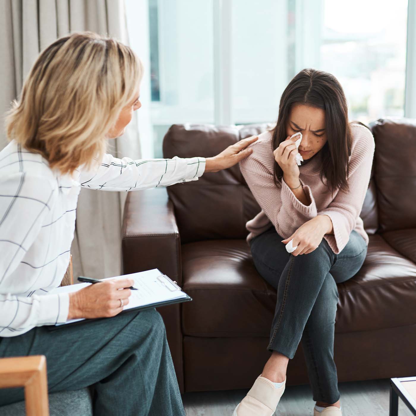 counselor working with young lady in home environment